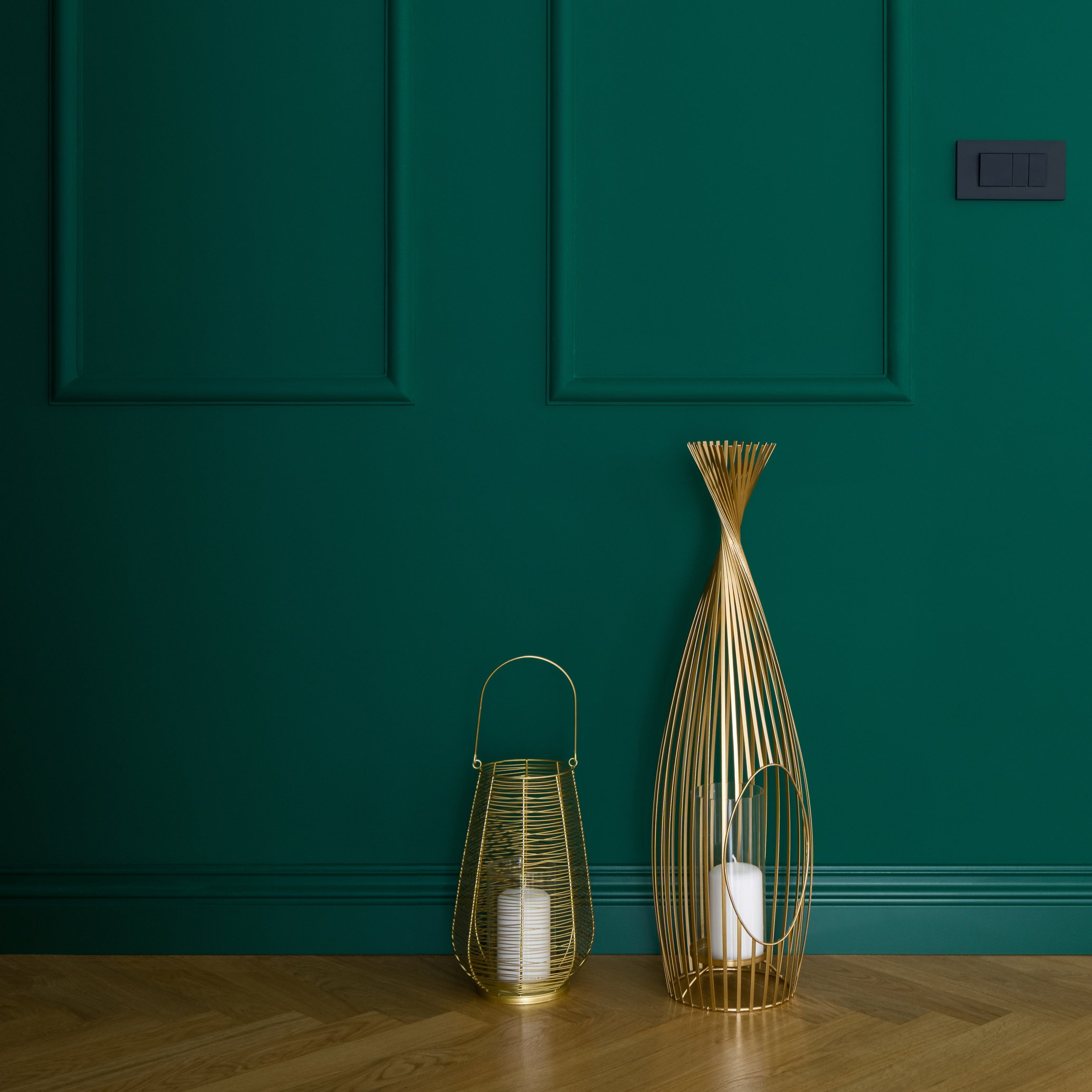 Golden decorations and emerald green wall